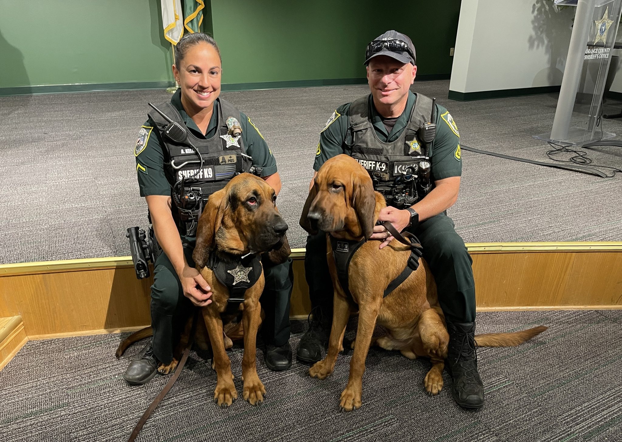 Two deputies posing with the blood hounds