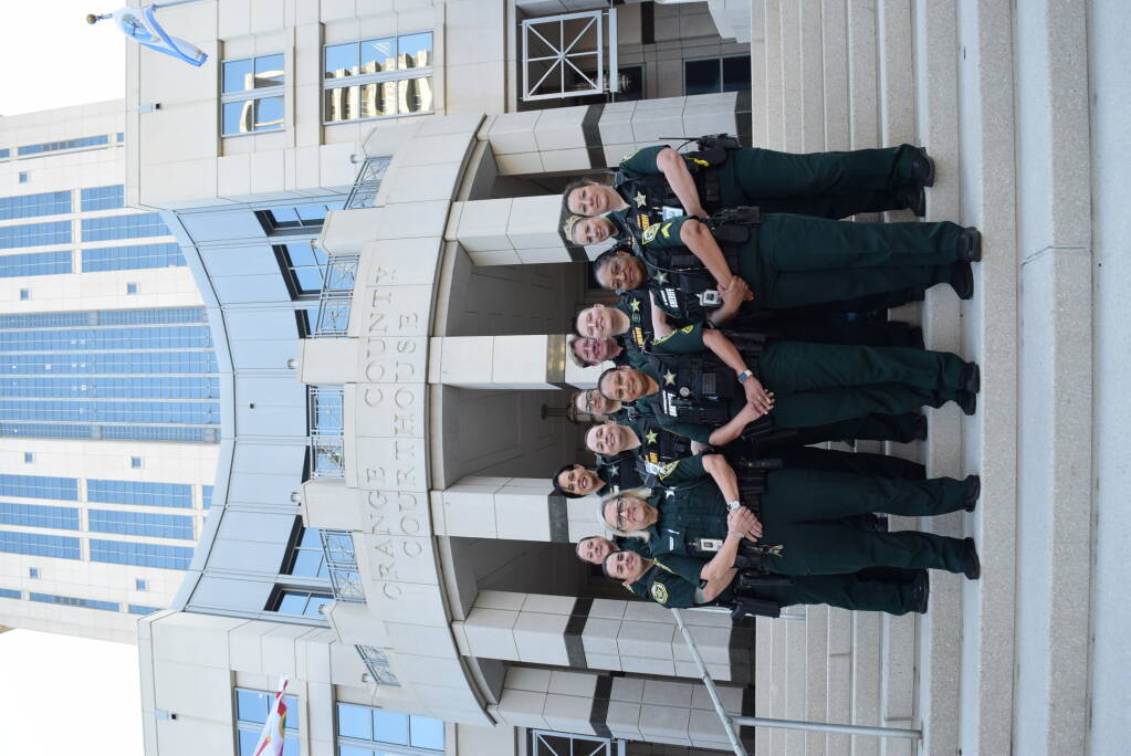 Court deputies posing in front of the court house