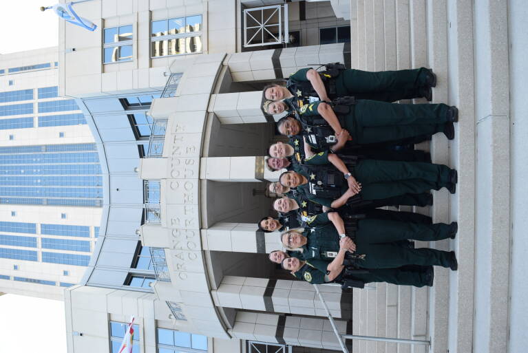 Court deputies posing in front of the court house