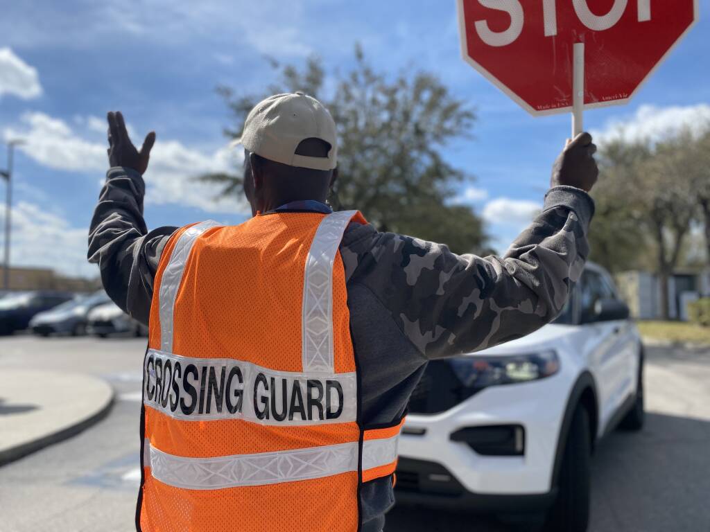 a rear view of a crossing guard