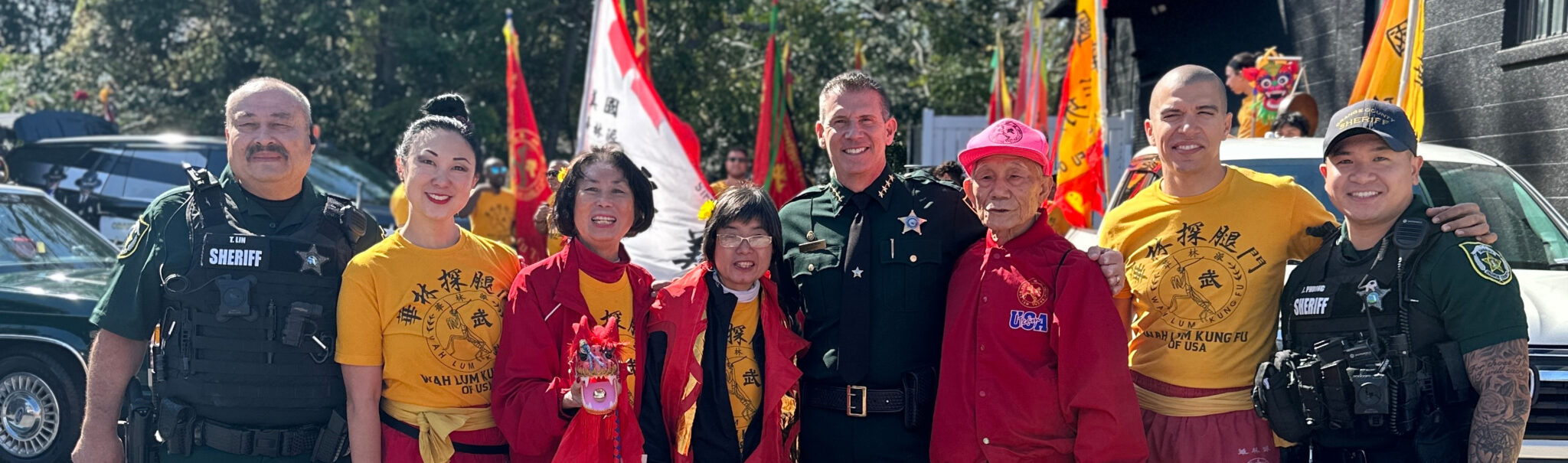 The Sheriff posing with members of the AAPI community