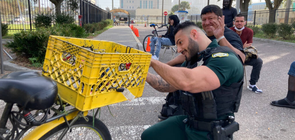 deputy repairing a bike