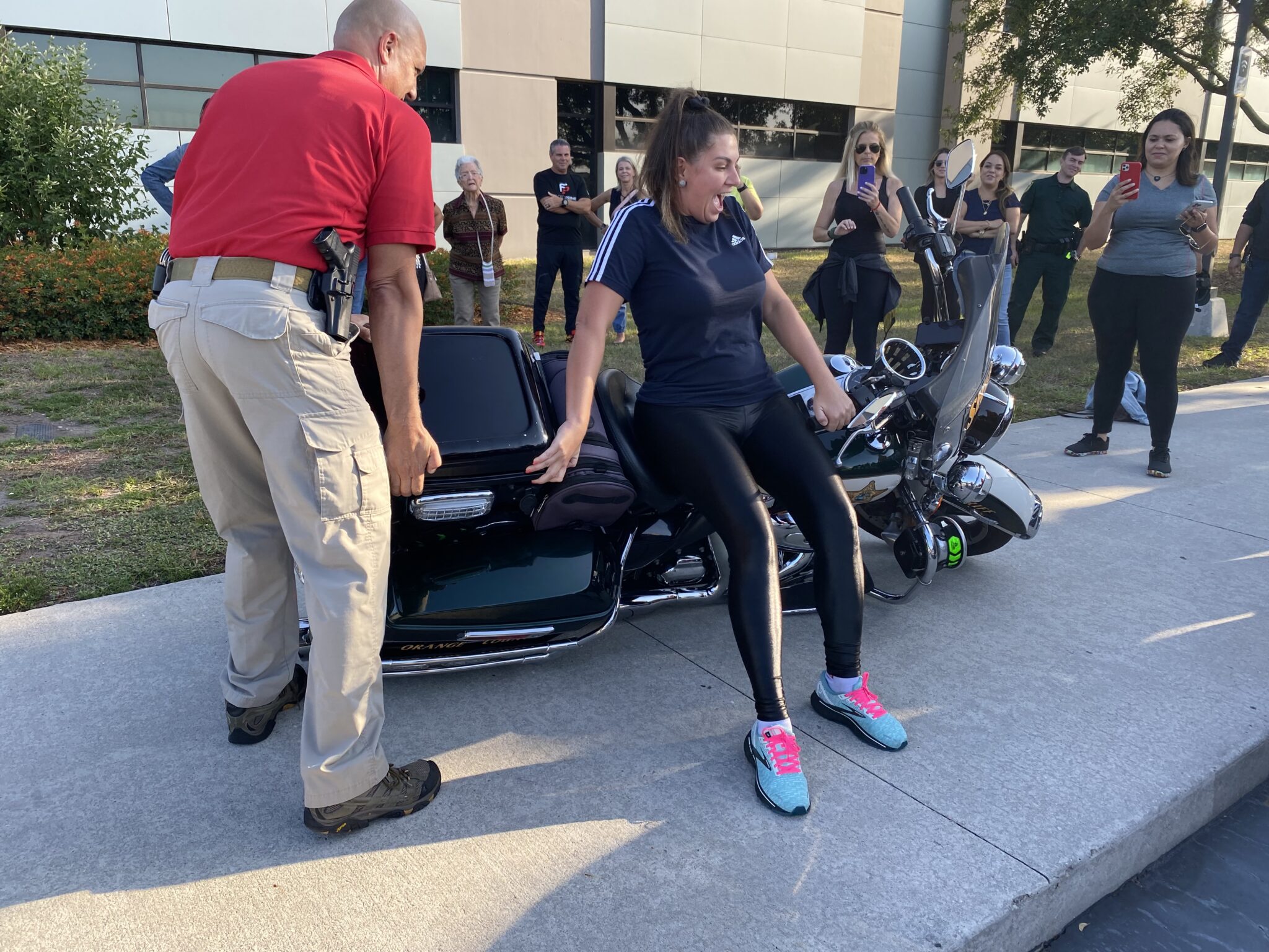 Civilian police academy student sitting on a motorcycle
