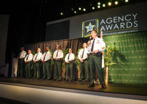 Sheriff Mina speaking on stage