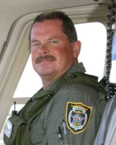 Deputy Craig Herber sitting in a cockpit