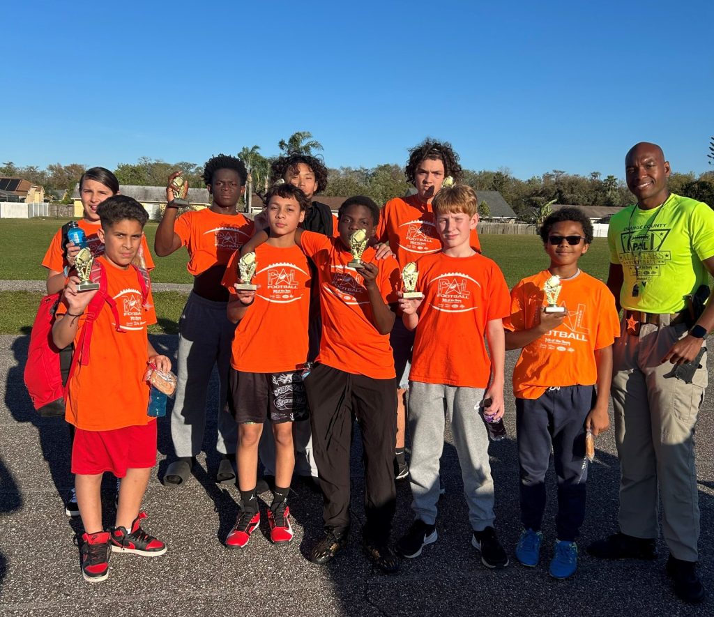 Corporal Dan Sneed with a team of kids.