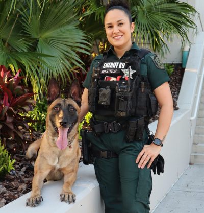 K9 deputy posing with canine partner